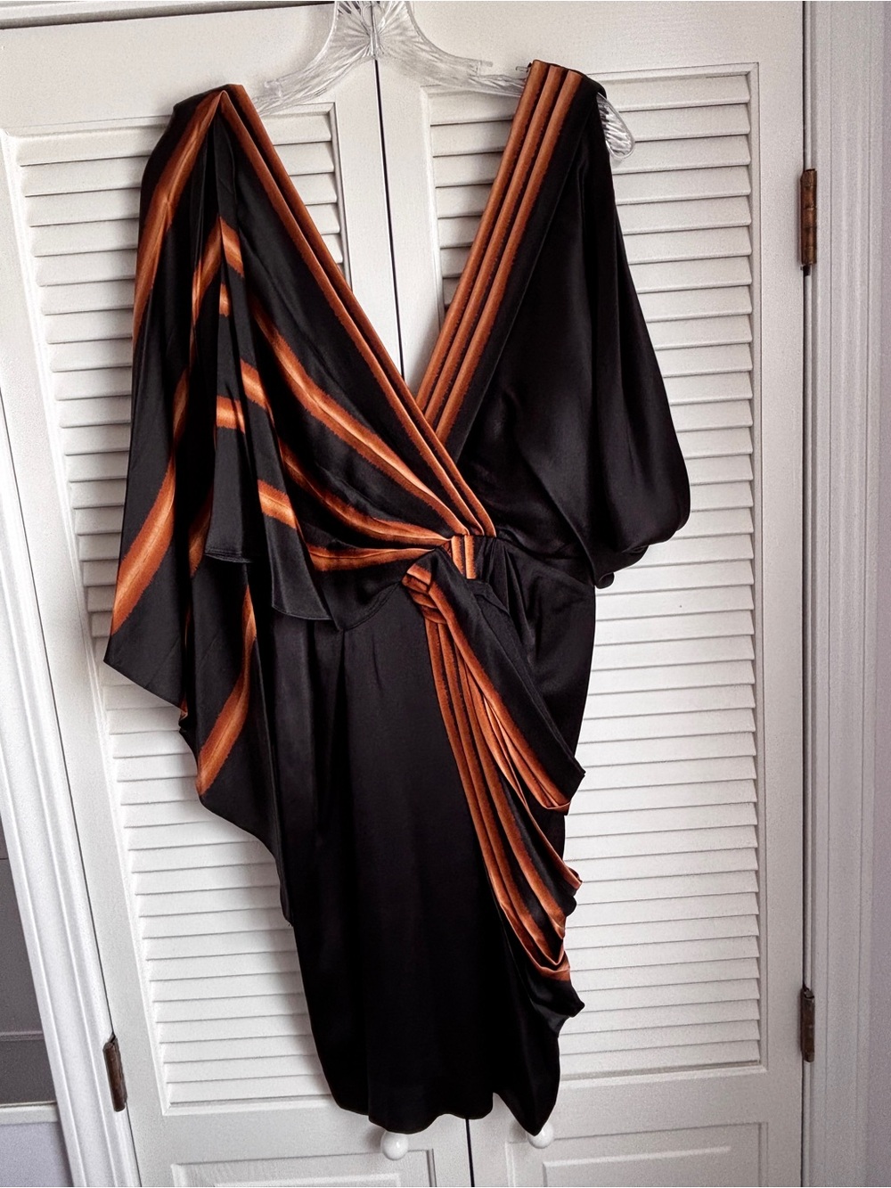 BCBGMAXAZRIA dress with black and gold  draped fabric with side zipper.